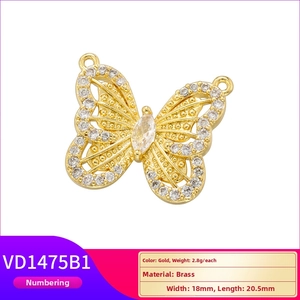 Detail view of 18x20.5mm brass butterfly pendant with sparkling zircon in gold finish