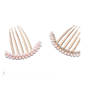 Detailed view of rose gold hair combs with white pearls and sparkling rhinestones