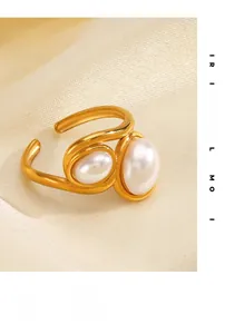 Detailed view of twin pearl open ring with 18k gold-plated fluid wrap design