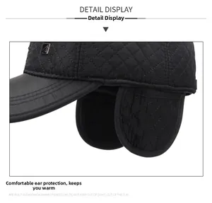 Detail of winter baseball cap with quilted pattern and ear flaps for warmth