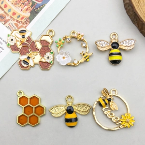 Set of 6 gold enamel bee and honeycomb charms featuring a Queen bee and floral wreath