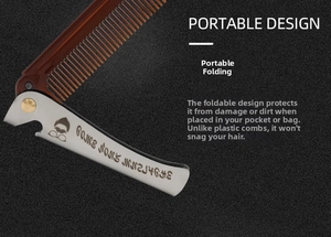 Detail of portable folding steel comb with brown teeth and engraved vintage metal handle