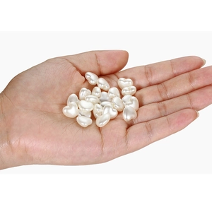 Handful of white heart-shaped ABS acrylic imitation pearl beads for DIY jewelry crafts