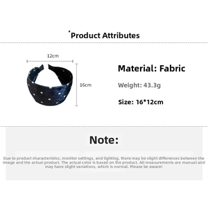 Detail view of a wide navy velvet headband with white polka dots showing dimensions 16x12cm