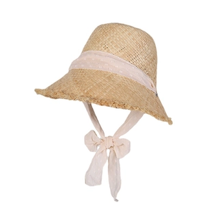 Handwoven straw sun hat with pink polka dot ribbon tie for beach vacation and travel