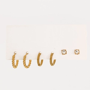 Detail view of 18k gold plated stainless steel twisted hoop earrings and zircon studs set