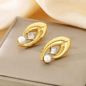 Detail of 18K gold-plated oval earrings with white pearl and square zircon inlay