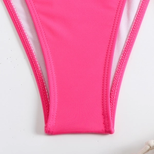Detailed close-up of rose pink bikini fabric with high-quality double-needle stitching
