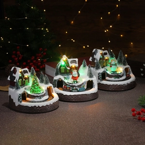 Illuminated rotating Christmas train music box with LED lights and festive snow scene decor