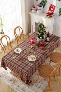 Close-up of a festive red and green plaid tablecloth for a warm Christmas table setting