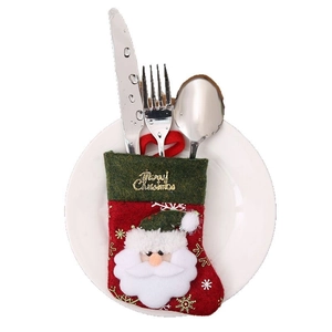 Christmas stocking cutlery holder with Santa motif and gold embroidery on red and green felt