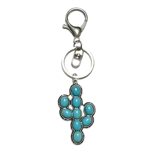 Western style silver cactus keychain with turquoise stones on white background