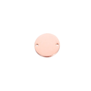 Macro view of rose gold round stainless steel pendant with dual side holes