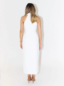 Rear view of white halter neck slim fit maxi dress with backless design