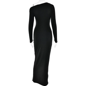 Detail of the back view showing shimmering black fabric of the one-shoulder long sleeve dress