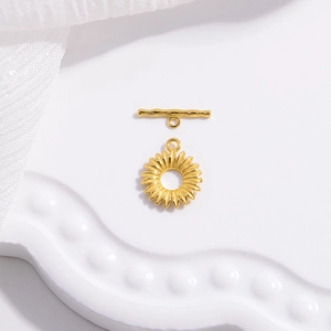 Macro detail of golden sunflower OT toggle clasp with textured T-bar for jewelry making