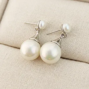 French vintage drop earrings featuring natural freshwater pearls and silver-tone accents