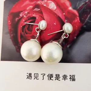 French vintage drop earrings featuring natural freshwater pearls and silver-tone accents