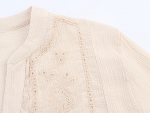 Detailed embroidery and lace hollow-out on beige textured cotton blouse shirt