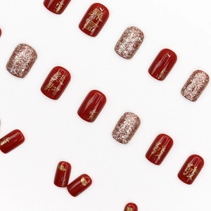 Festive red glossy press-on nails with rose gold glitter and gold Chinese characters