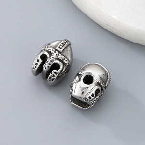 Macro detail of silver stainless steel helmet-shaped spacer beads for jewelry making