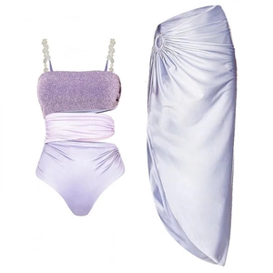 Sparkly purple swimsuit set with shimmery top and matching satin wrap skirt with buckle