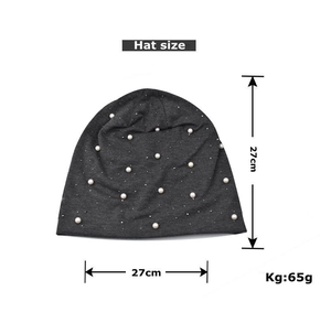 Flat lay of a grey knit beanie with white pearls showing 27cm x 27cm dimensions
