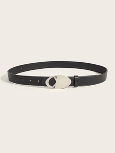 Detailed view of black leather belt featuring a polished silver metal D-shaped buckle