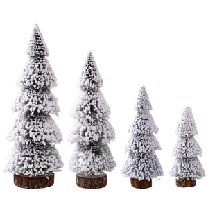Mini cedar Christmas trees with snow effect and wooden base set of four on white background