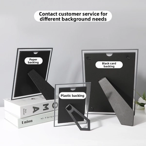 Detail view of crystal glass frame backing with paper and plastic support stands