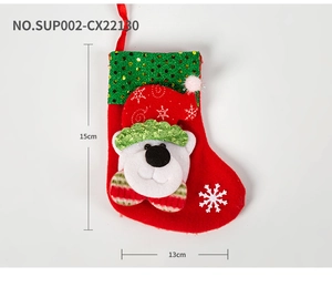 Detail showing 15cm Christmas stocking with sequins, polar bear character and white snowflakes