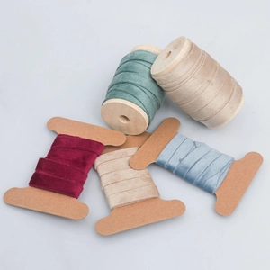 Multi-color 1cm double-sided velvet ribbon on wooden spools for DIY crafts and gift wrapping