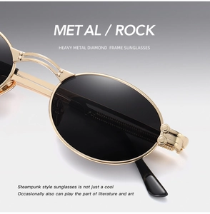 Close-up of steampunk sunglasses featuring gold metal frame and black oval lenses