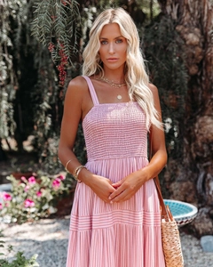 Detail of pink striped maxi dress featuring smocked bodice and layered bohemian ruffles