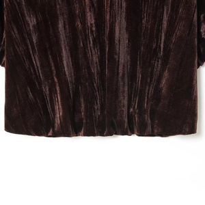 Deep burgundy velvet top with elegant balloon silhouette and rich pleated texture