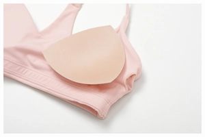 Detailed view of the removable chest pads and internal pocket on this pink sports bra