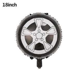 Detail of 18-inch black racing tire foil balloon with silver rim design for parties