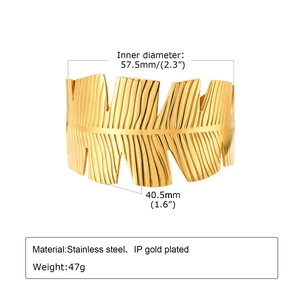 Detailed view of golden leaf texture cuff with diameter and material measurements
