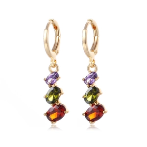 Golden drop earrings with colorful purple, green, and orange oval zircon crystals