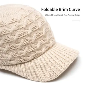 Beige chunky knit baseball cap with foldable brim and textured cable knit pattern