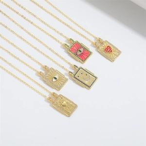 Set of five gold vintage evil eye tarot pendant necklaces with colorful enamel inlay