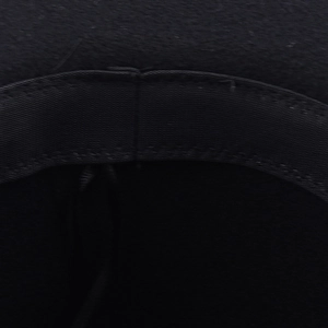 Detail view of the black wool felt hat interior showing a durable elastic sweatband