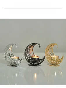Detailed view of metal crescent moon incense burners with intricate hollow patterns