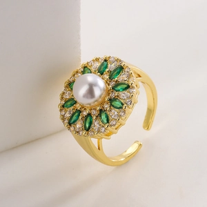 Detailed side view of 18K gold plated ring with white pearl and green marquise zircon