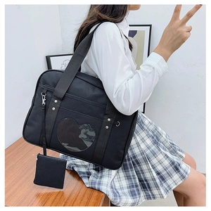 Detail of JK style travel bag featuring a heart-shaped clear window and coin pouch
