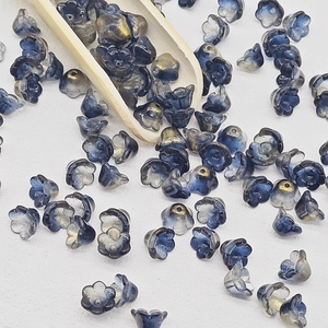 Macro shot of 7x12mm lily of the valley gradient glass flower beads for DIY jewelry