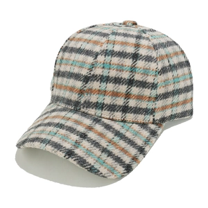 Close-up of thick plaid wool blend fabric texture on classic winter baseball cap