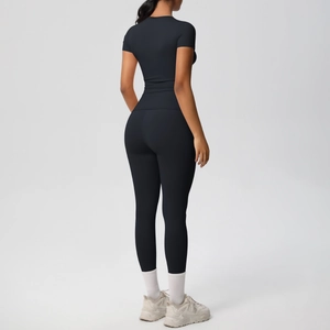 Back view of a black two-piece yoga set showing the slim fit and high-waisted leggings