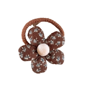 Floral fabric hair tie in brown with white patterns for girls' high ponytail hair styling