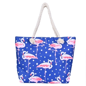 Detail of pink flamingo canvas beach bag with thick rope handles and metal eyelets
